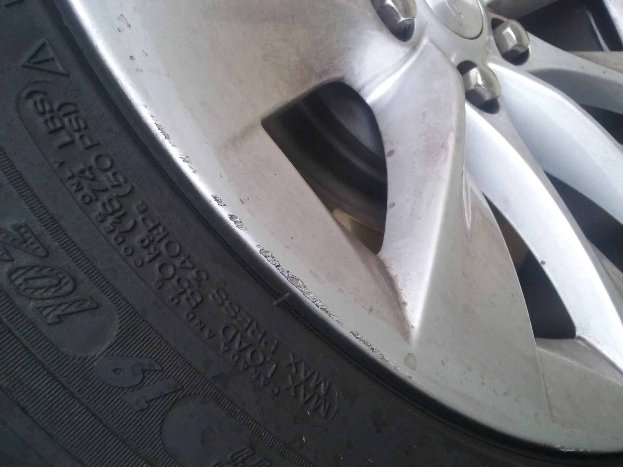 Tesla alloy wheel curb rash repair silver finish